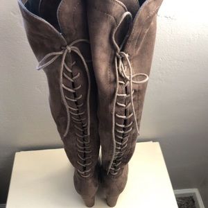 Thigh high boots with lace in the back